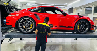 Professional Car Inspection Service - Red Vehicle Assessment in Doha